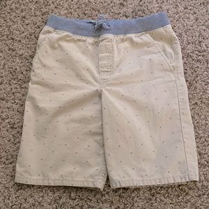 Cream shorts with back pockets.